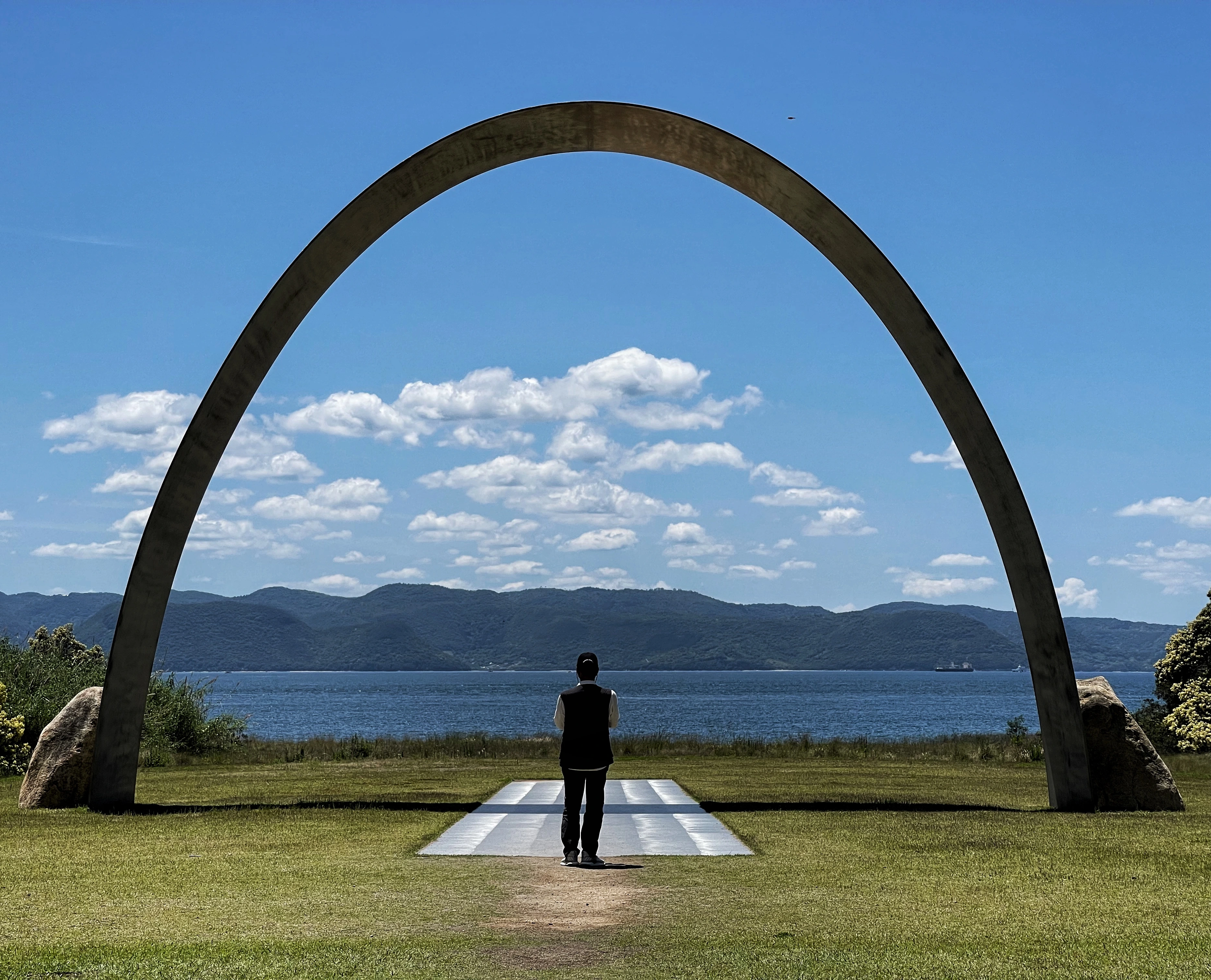 Arch sculpture overlooking lake